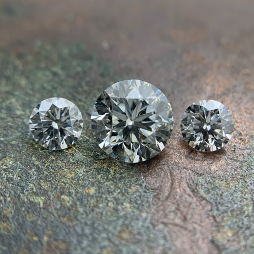 three brilliant round cut diamonds