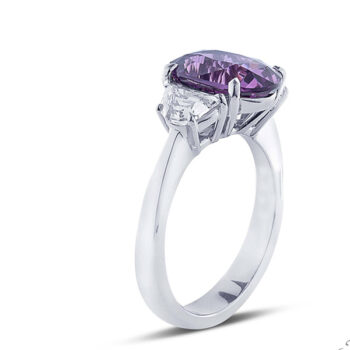 three stone diamond ring with purple sapphire and half moon step cut diamond side stones