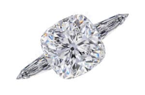 cushion cut three stone ring with tapered bullet side stones